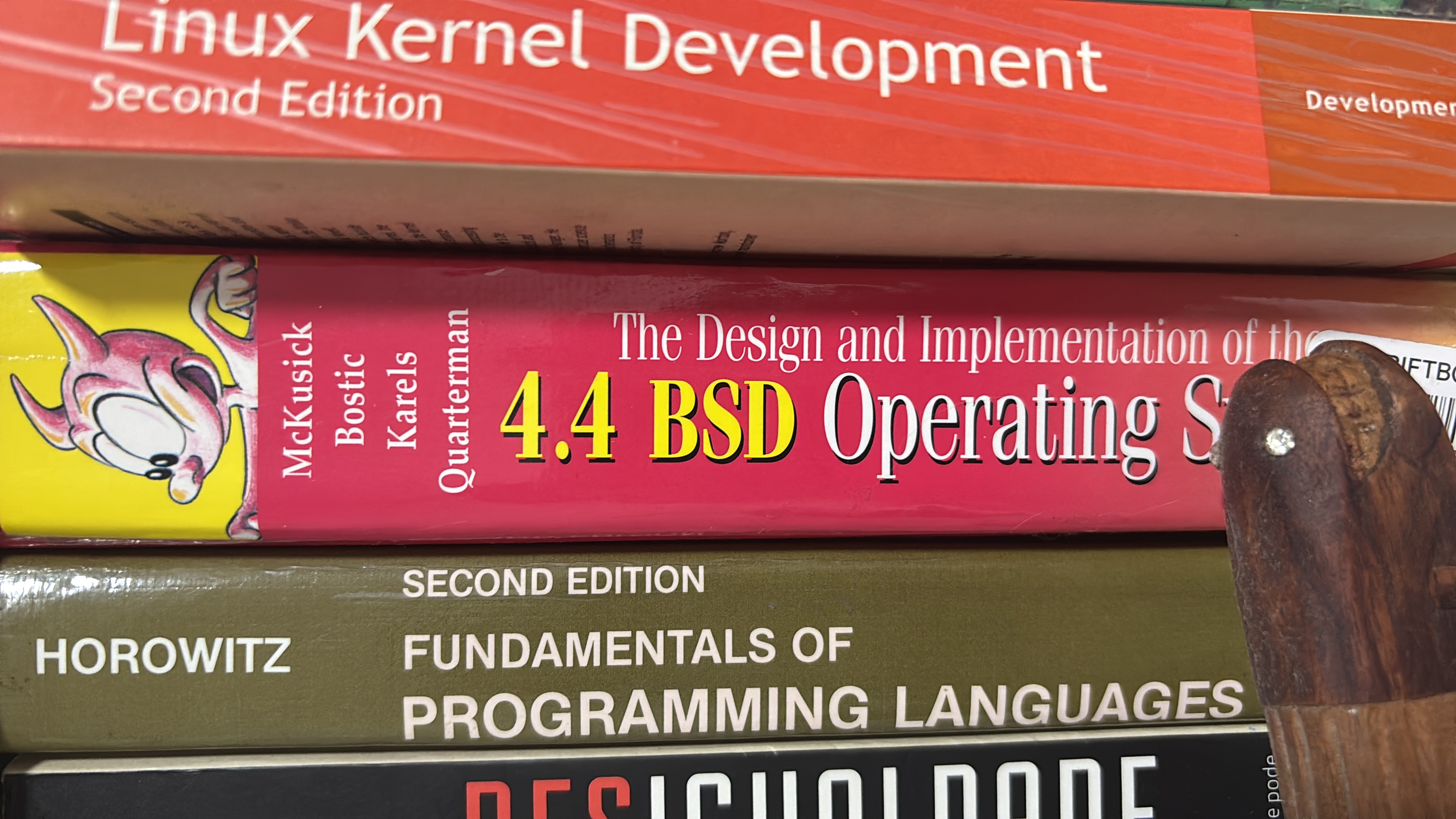 A small stack of BSD-related books